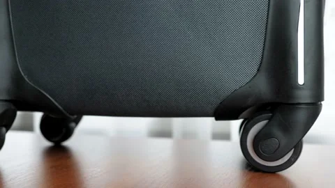 Close-up female hands close the suitcase and fasten it with a lock. The girl Stock Footage 212462653