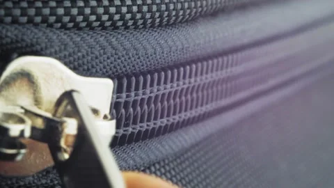 Close-up female hands close the suitcase and fasten it with a lock. The girl Stock Footage 226753605