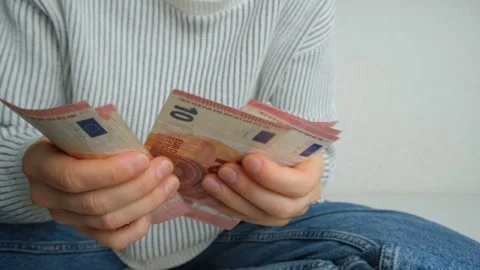 Close up of female hands counting 10 Euro bills. Stock Footage 332653698