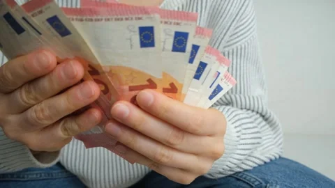 Close up of female hands counting 10 Euro bills Stock Footage 333130926