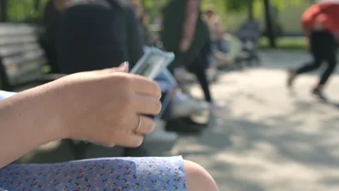 Close-up of female hands counting a stack of hundred dollar US banknotes. a Stock Footage 246662541