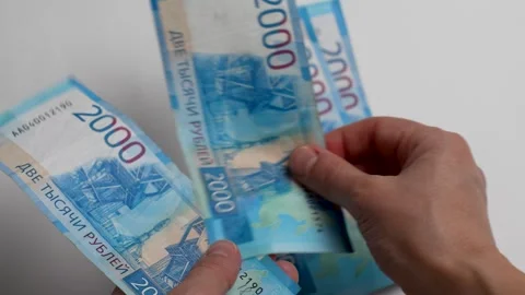 Close-up of female hands counting a stack of Russian ruble money Stock-Footage 256216013
