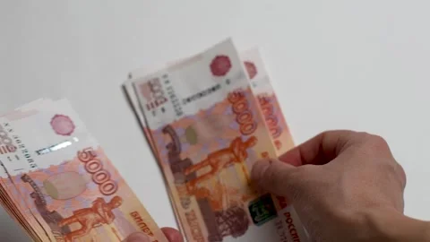 Close-up of female hands counting a stack of Russian ruble money Stock Footage 256216014