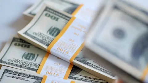 Close-up of female hands counting a stack of hundred-dollar US banknotes. a Stock Footage 267872817