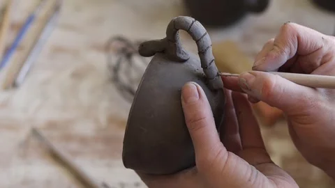 A close-up of female hands doing clay modeling. Stock Footage 275114536
