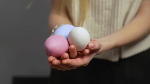 Close-up of female hands holding Easter eggs. Christ is risen. Church holiday Stock Footage 171490610