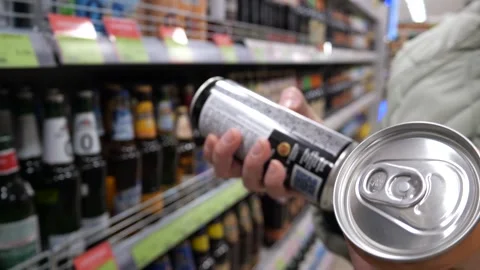 Close-up of female hands holding two cans of alcohol Stock Footage 304807895