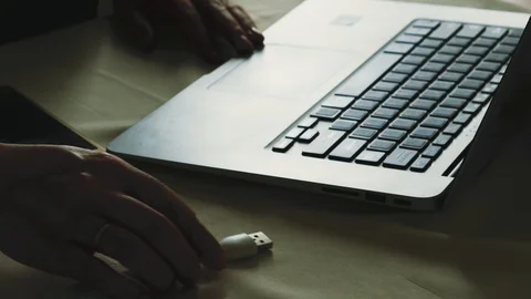 Close-up of female hands inserting the USB lamp into the laptop Stock Footage 108054363