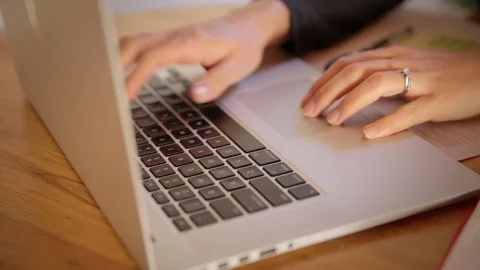 Close up of female hands on laptop doing budgeting Stock Footage 126560948