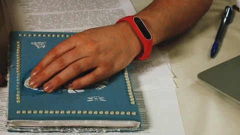 Close-up of female hands that leaf through the pages in a handmade notebook Stock Footage 108056284