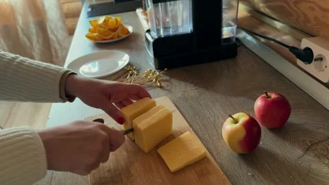 Close-up of female hands make a canapes for a festive table Stock Footage 293595227