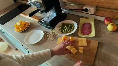 Close-up of female hands making canapes for a festive table Stock Footage 293582715