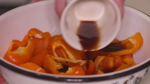 Close-up of Female Hands Marinating Sliced Bell Peppers with Soy Sauce 스톡 동영상 335236074