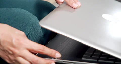 Close up of female hands opening computer. Woman freelancer working on laptop at Stock Footage 151010317