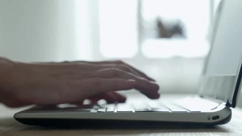 Close-up of female hands opening laptop and typing on keyboard Stock Footage