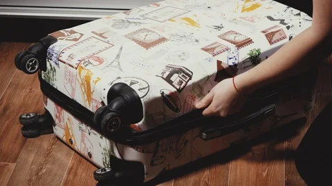 Close-up of female hands opening a suitcase Stock Footage 101646983