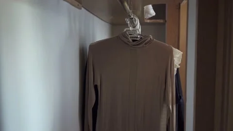 Close-up of female hands opening wardrobe and choosing what to wear Stock Footage 132037745