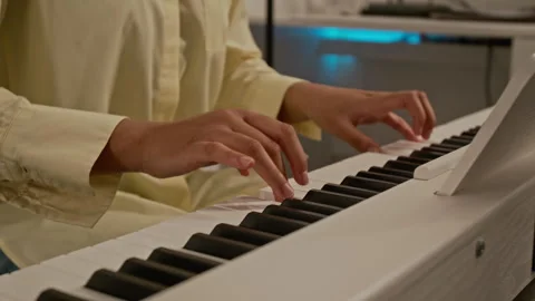 Close-Up of Female Hands Playing Classical Music on Digital Keyboard Stock Footage 339182251