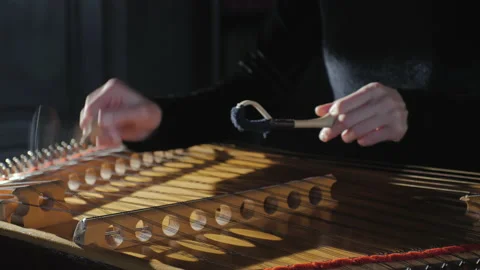 Close-up of female hands playing on hammered dulcimer. Hammer dulcimer closeup. Stock Footage 145757403