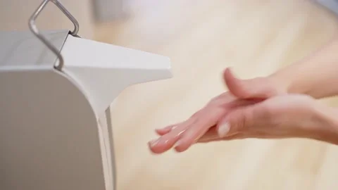 Close-up female hands press the diffuser of liquid alcohol hand sanitizer Video stock 171418879