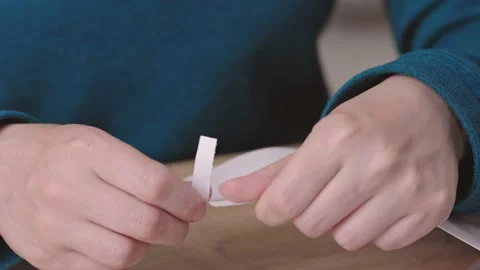 Close-up female hands pull out paper envelope utility bill paper letter bank Stock Footage 219546776