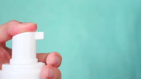 Close-up, female hands push the dispenser, squeezes out the cream. super slow Stock-Footage 80508467