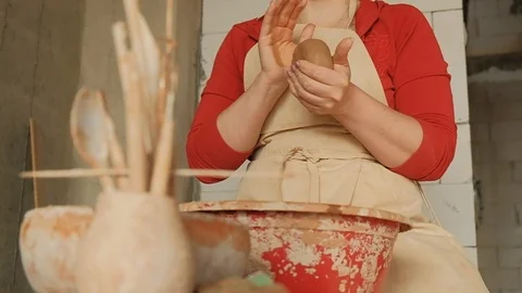 Close-up female hands rolling clay ball before working on a pottery wheel Stock Footage 103151980