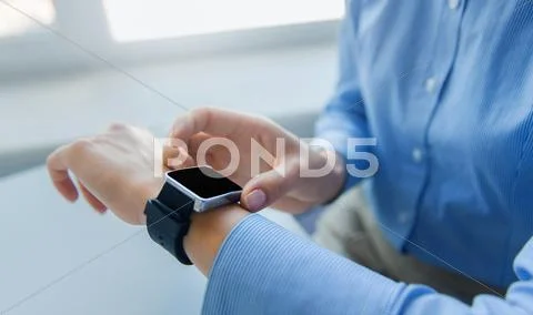 Close up of female hands setting smart watch Stock Photos
