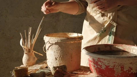 Close-up female hands shoosing instruments before working on a pottery wheel Stock Footage 101702935