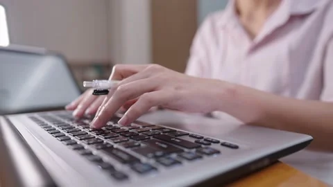Close up female hands sitting typing on laptop computer laptop Video stock 168482582