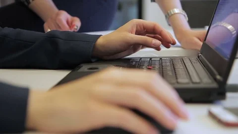 Close-up of female hands in suit work with mouse over laptop. Stock Footage 83528412