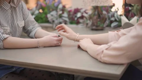 Close up of female hands on a table in a cafe 库存影片 144598890
