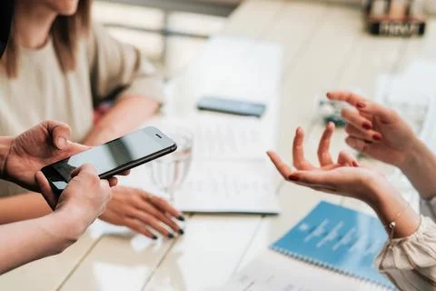 Close Up of Female Hands at Table, Two Women Making Order to Waiter with Stock Photos