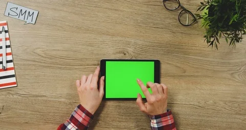 Close up on the female hands taping on the black horizontal tablet device with a Stock-Footage 89954089