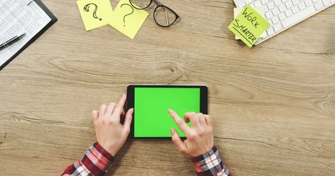 Close up of the female hands taping on the black horizontal tablet device with a Stock Footage 89967931