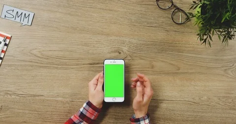 Close up on the female hands taping on the white vertical smartphone with a Stock Footage 89953173