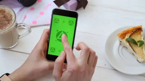 Close Up of Female Hands Tapping on The Green Screen Phone Mock up. Stock Footage 116613682