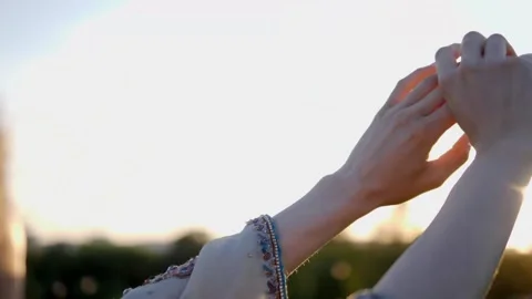 Close-Up of Female Hands Touching in Golden Sunlight Stock Footage 346027162