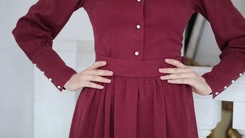 Close - up of female hands touching the red belt of the dress Video stock 102379560