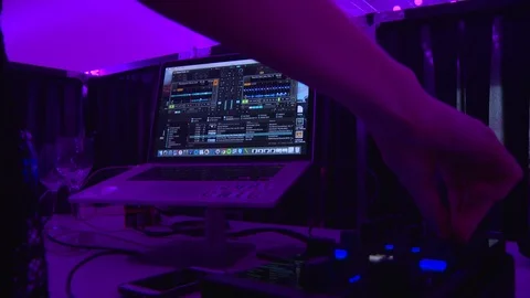 Close up of female hands turning knobs on professional DJ mixer console Video stock 85562070