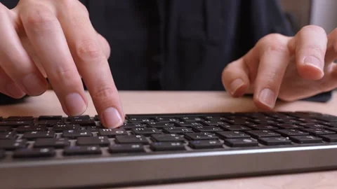 Close-up of female hands typing on computer keyboard Stock Footage 327670307