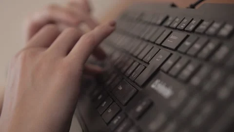 Close-up of female hands typing keyboard Stockbeeldmateriaal 153415765