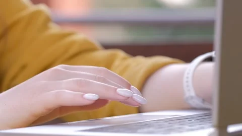 Close-up of female hands typing laptop keyboard. young woman using laptop Stock Footage 242106959