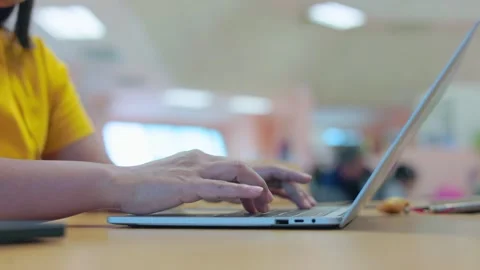 Close up of female hands typing on laptop keyboard in office. Stock Footage 329564605