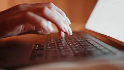 Close up of female hands typing on modern laptop Stock Footage 165171402