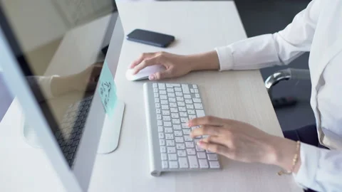 Close up of female hands typing report on keyboard while working in the office Stock Footage 88461825