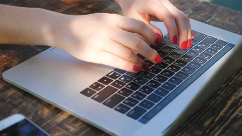 Close up of female hands typing some text on notebook keyboard. Woman working Stock Footage 126985055