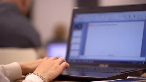 Close-up of female hands typing text message on laptop, young student sitting at Stock Footage 89770614