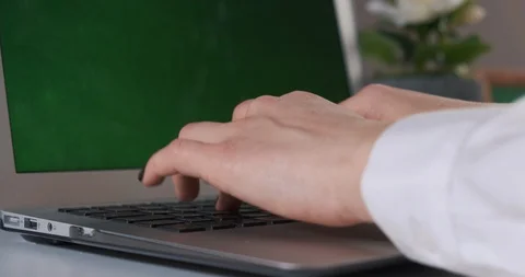 Close-up of female hands typing text on laptop, green screen, keying, computer Stock Footage 125732185