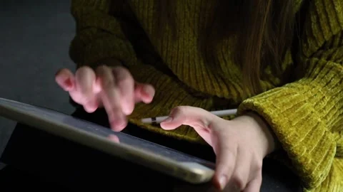 Close-up of female hands typing text information on a digital tablet device Stock Footage 144471100